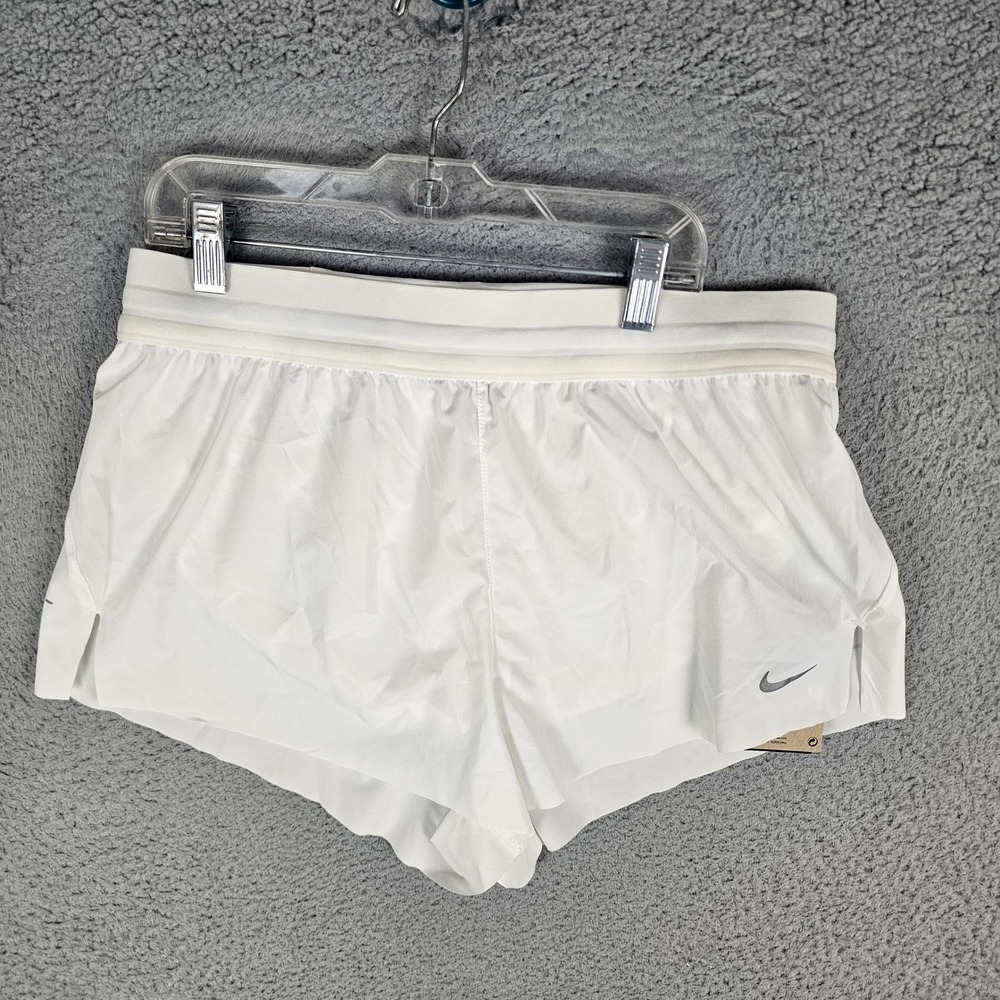 Nike Women's White Athletic Shorts with Silver Swoosh